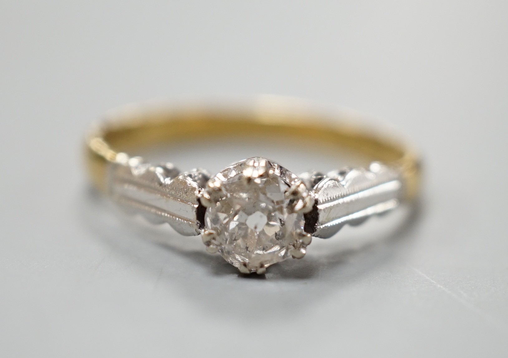 A modern 18ct gold and solitaire diamond ring, size M, gross weight 2.7 grams.